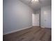 Bedroom with neutral paint, wood-look flooring, base molding and ceiling fan at 4694 E Glen Ridge E Cir, Winston, GA 30187