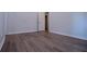 This bedroom features wood-look flooring, light-colored walls, and clean lines at 4694 E Glen Ridge E Cir, Winston, GA 30187