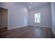 Bright bedroom featuring wood-look flooring and natural light from the window at 4694 E Glen Ridge E Cir, Winston, GA 30187