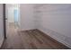 Walk-in closet featuring white wire shelving and modern flooring at 4694 E Glen Ridge E Cir, Winston, GA 30187