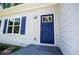 Close-up of front door featuring blue paint, white trim, with window and siding and covered deck at 4694 E Glen Ridge E Cir, Winston, GA 30187