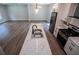 Open-concept kitchen with a marble countertop island and stainless steel appliances at 4694 E Glen Ridge E Cir, Winston, GA 30187