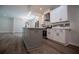Modern kitchen featuring white cabinets, stainless steel appliances, kitchen island and stylish pendant lighting at 4694 E Glen Ridge E Cir, Winston, GA 30187