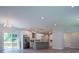 Open-concept living area with modern kitchen, access to the backyard deck, and plenty of natural light at 4694 E Glen Ridge E Cir, Winston, GA 30187
