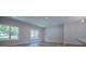 Open concept living room featuring large windows, modern flooring and recessed lighting at 4694 E Glen Ridge E Cir, Winston, GA 30187