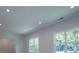 Living room featuring two large windows that provide a view of the backyard at 4694 E Glen Ridge E Cir, Winston, GA 30187