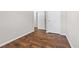Bedroom with hardwood floors and white doors, featuring minimal design and light-colored walls at 5399 Kristian Ct, Stone Mountain, GA 30088