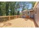 Inviting wooden deck offering a relaxing outdoor space with a natural wood railing and ample space at 5399 Kristian Ct, Stone Mountain, GA 30088