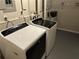 Modern laundry area with front loading washer and dryer for convenient laundry tasks at 5399 Kristian Ct, Stone Mountain, GA 30088