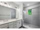 Modern bathroom featuring a dual vanity and a glass-enclosed shower at 687 Avondale Creek Dr, Decatur, GA 30032