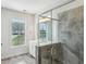 Modern bathroom features a glass-enclosed shower and double vanity at 687 Avondale Creek Dr, Decatur, GA 30032