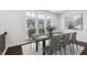 Elegant dining room featuring hardwood floors, natural light, and modern table setting at 687 Avondale Creek Dr, Decatur, GA 30032