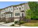 Charming townhome with brick facade, manicured lawn, and private garage at 687 Avondale Creek Dr, Decatur, GA 30032