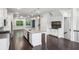 Open-concept kitchen with island, stainless appliances, and hardwood floors leading to living areas at 687 Avondale Creek Dr, Decatur, GA 30032