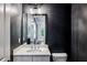 Chic powder room with stylish vanity and dark gray walls at 687 Avondale Creek Dr, Decatur, GA 30032