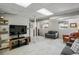 Finished basement showcasing a large television, comfortable furniture and neutral carpet at 1110 Tuxedo Dr, Roswell, GA 30075