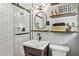Updated bathroom featuring a sleek vanity, white subway tile shower, and modern lighting at 1110 Tuxedo Dr, Roswell, GA 30075