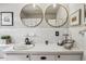 Bright bathroom featuring dual vanity sinks, ample counter space, and natural light at 1110 Tuxedo Dr, Roswell, GA 30075