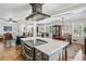 Modern kitchen featuring an island, stainless steel appliances, and an open layout connecting to living spaces at 1110 Tuxedo Dr, Roswell, GA 30075