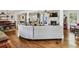 Open-concept living room with hardwood floors, a cozy fireplace, and seamless flow into the kitchen at 1110 Tuxedo Dr, Roswell, GA 30075