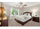 Comfortable bedroom featuring a queen bed, complemented by classic furnishings and a serene ambiance at 2130 Federal Rd, Roswell, GA 30075