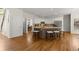 Spacious kitchen with island, stainless appliances, white cabinets and hardwood flooring at 2130 Federal Rd, Roswell, GA 30075