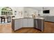Open kitchen with island and stainless steel dishwasher at 2130 Federal Rd, Roswell, GA 30075