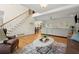 Spacious living area with stairs, hardwood floors, and seamless flow at 2130 Federal Rd, Roswell, GA 30075