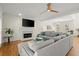 Bright living room with fireplace, TV and hardwood floors at 2130 Federal Rd, Roswell, GA 30075