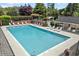 Community pool surrounded by lounge chairs and mature trees, perfect for relaxation at 2130 Federal Rd, Roswell, GA 30075