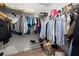 Walk-in closet with custom shelving and ample hanging space, designed for optimal organization and accessibility at 2130 Federal Rd, Roswell, GA 30075