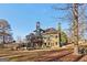 Expansive backyard features a deck, patio, and lush greenery for outdoor living at 283 Rosebay Ln, Sharpsburg, GA 30277