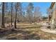 Extensive backyard with mature trees and a serene, natural setting; plenty of room to roam at 283 Rosebay Ln, Sharpsburg, GA 30277