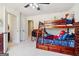 This bright bedroom features a wooden bunk bed, study desk, and natural light at 283 Rosebay Ln, Sharpsburg, GA 30277