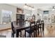 Bright dining room with a large window and table for eight at 283 Rosebay Ln, Sharpsburg, GA 30277