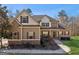 Charming two-story home with a well-maintained front yard and welcoming porch at 283 Rosebay Ln, Sharpsburg, GA 30277