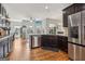 Modern kitchen with stainless steel appliances and an open floor plan at 283 Rosebay Ln, Sharpsburg, GA 30277