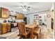 Kitchen and dining area with hardwood floors, stainless steel oven, and wood cabinets at 283 Rosebay Ln, Sharpsburg, GA 30277