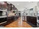 Spacious kitchen features stainless steel appliances and dark wood cabinets at 283 Rosebay Ln, Sharpsburg, GA 30277