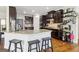 Kitchen features stainless steel appliances, granite countertops, and a breakfast bar at 283 Rosebay Ln, Sharpsburg, GA 30277
