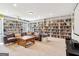 Spacious living room with cozy seating and extensive built-in bookshelves at 283 Rosebay Ln, Sharpsburg, GA 30277