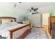 This main bedroom has a bed, dresser and en-suite bathroom at 283 Rosebay Ln, Sharpsburg, GA 30277