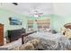 This main bedroom has two windows, a television, and a dresser at 283 Rosebay Ln, Sharpsburg, GA 30277