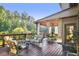 Inviting back deck with comfortable seating, dining area, and view of the backyard at 3704 Wilkins Cir, Powder Springs, GA 30127
