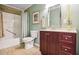 Bathroom with a shower-tub combination, toilet and vanity with storage space at 3704 Wilkins Cir, Powder Springs, GA 30127