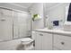 Clean bathroom featuring a shower and tub combination with sliding doors, plus a white vanity at 3704 Wilkins Cir, Powder Springs, GA 30127