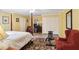 Spacious bedroom with a sitting area, four poster bed, workout bench and ample closet space at 3704 Wilkins Cir, Powder Springs, GA 30127