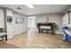 Versatile bonus room with neutral walls, wood-look floors, and a sliding barn door at 3704 Wilkins Cir, Powder Springs, GA 30127