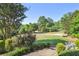 Expansive front yard featuring lush greenery and meticulously maintained landscaping at 3704 Wilkins Cir, Powder Springs, GA 30127