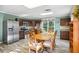 Eat-in kitchen with stainless steel appliances, modern cabinetry, and a cozy dining area at 3704 Wilkins Cir, Powder Springs, GA 30127